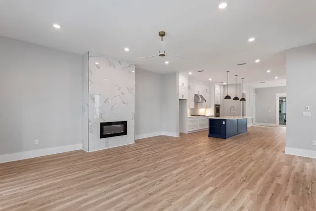 a view of an empty room and wooden floor