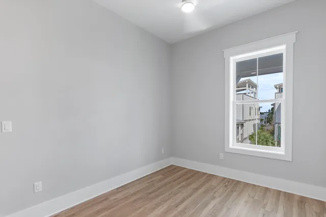 a view of a patio with table and chairs potted plants with wooden floor