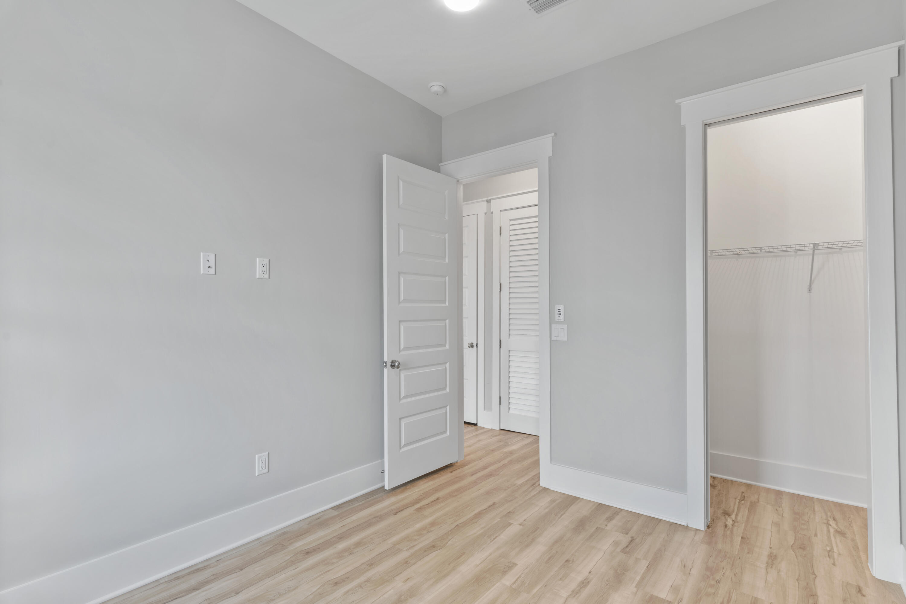 21 West Queen Palm Dr Inlet Beach Inlet Beach, FL 32461 - Photo 46 of 85 a view of an empty room and wooden floor