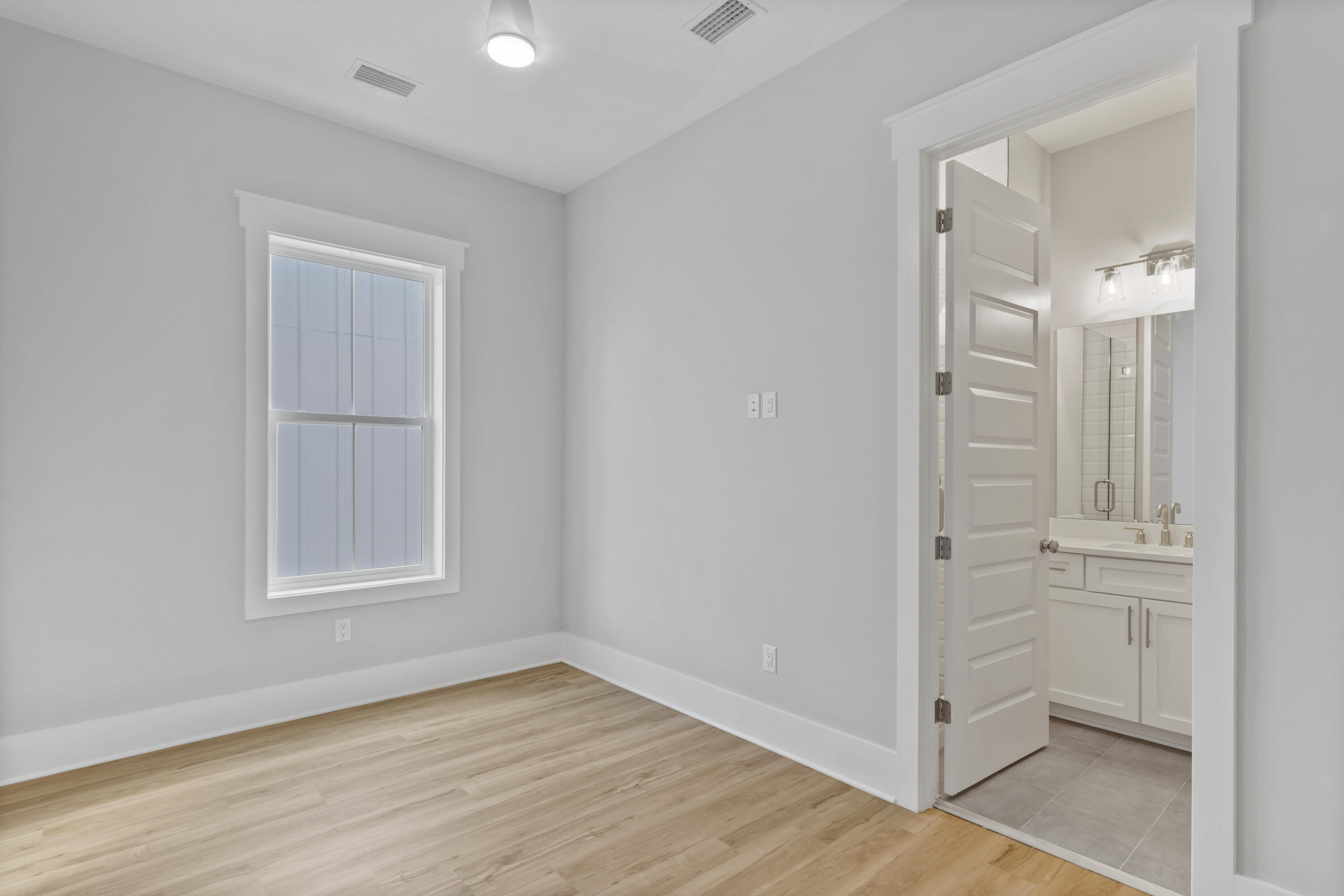 21 West Queen Palm Dr Inlet Beach Inlet Beach, FL 32461 - Photo 51 of 85 an empty room with wooden floor and closet