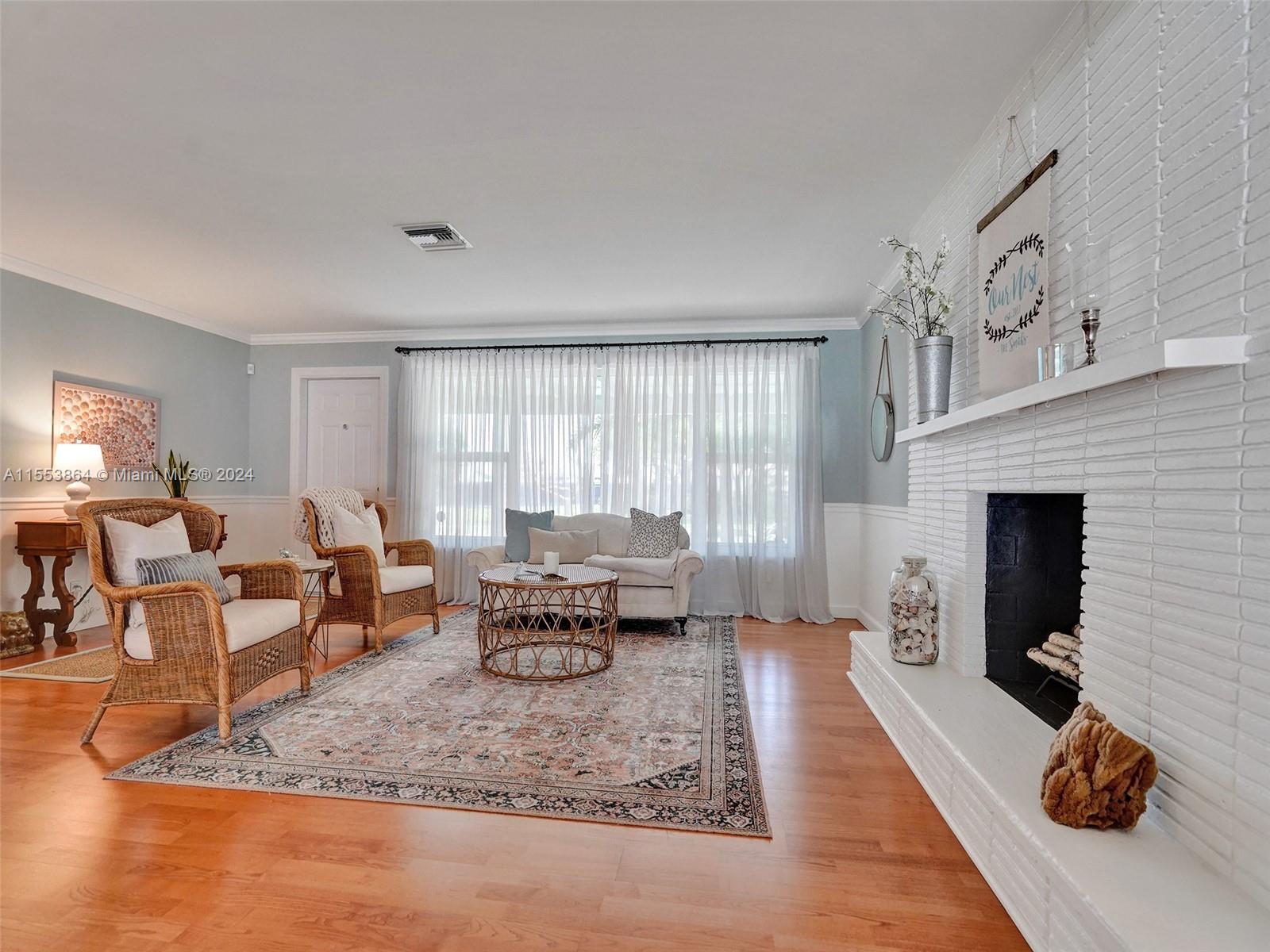 3445 Fillmore Street Hollywood, FL 33021 - Photo 11 of 76 a living room with furniture or couch and a fireplace