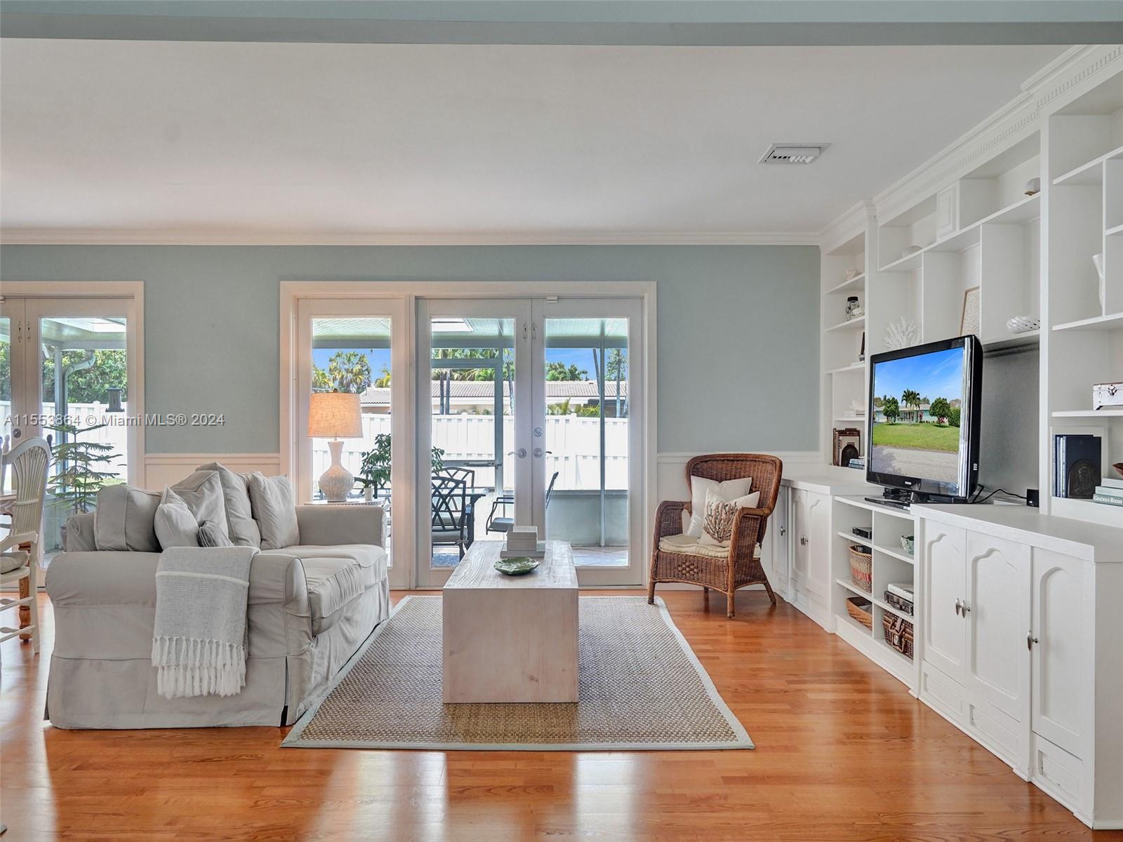 3445 Fillmore Street Hollywood, FL 33021 - Photo 13 of 76 a living room with furniture and a flat screen tv