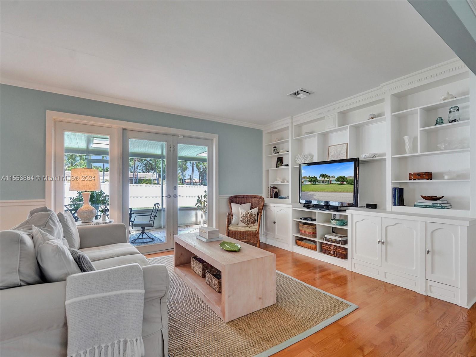 3445 Fillmore Street Hollywood, FL 33021 - Photo 14 of 76 a living room with furniture and a flat screen tv