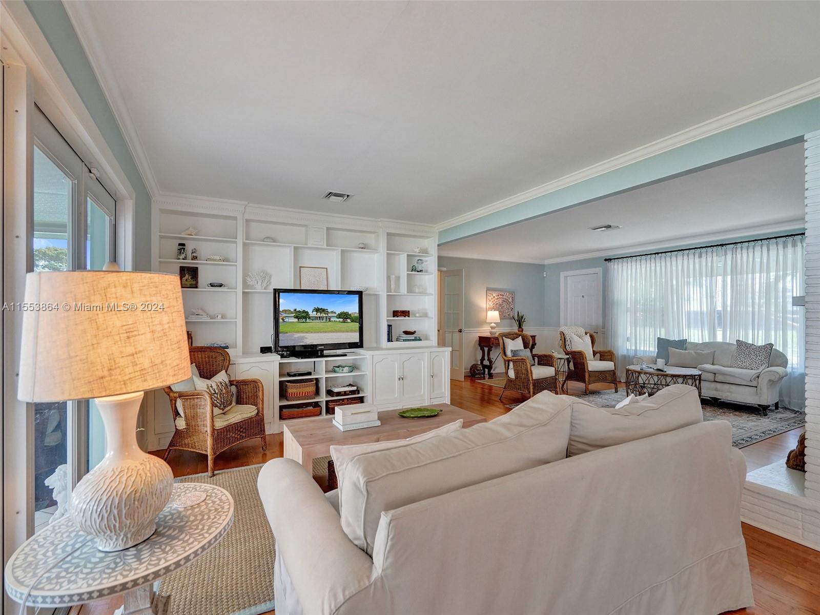 3445 Fillmore Street Hollywood, FL 33021 - Photo 17 of 76 a living room with furniture and a flat screen tv