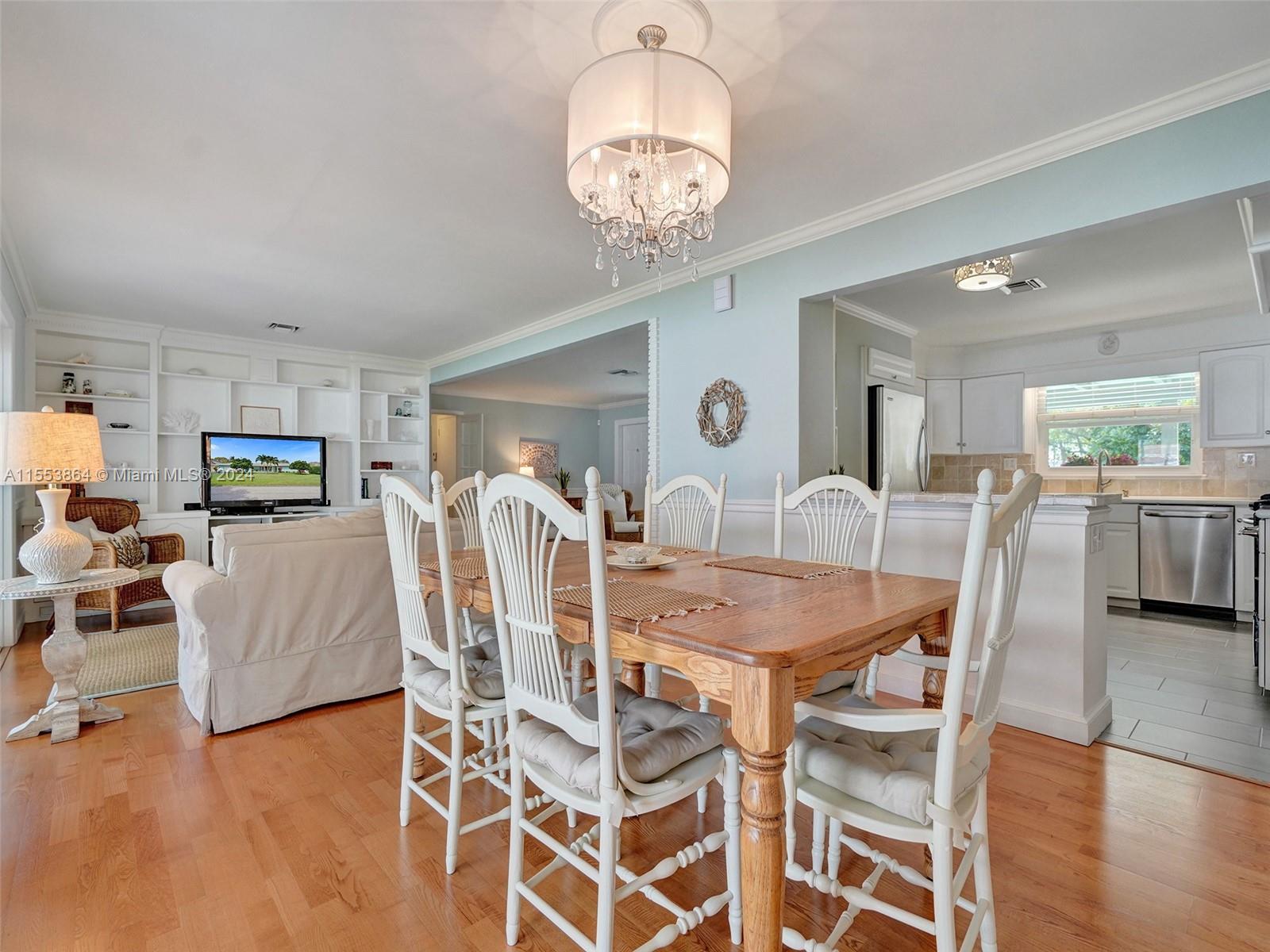 3445 Fillmore Street Hollywood, FL 33021 - Photo 21 of 76 a view of a dining room with furniture and wooden floor