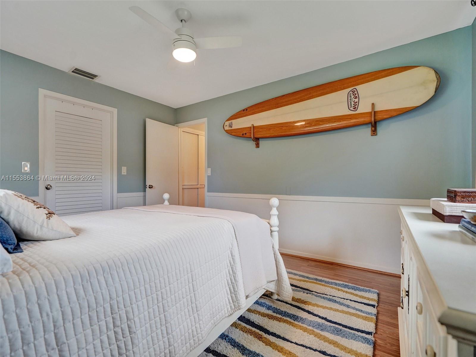 3445 Fillmore Street Hollywood, FL 33021 - Photo 35 of 76 a bedroom with a bed and a dresser