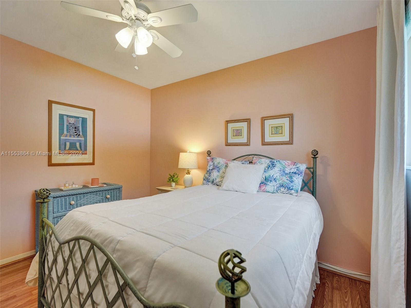 3445 Fillmore Street Hollywood, FL 33021 - Photo 44 of 76 a bedroom with a bed and a chandelier