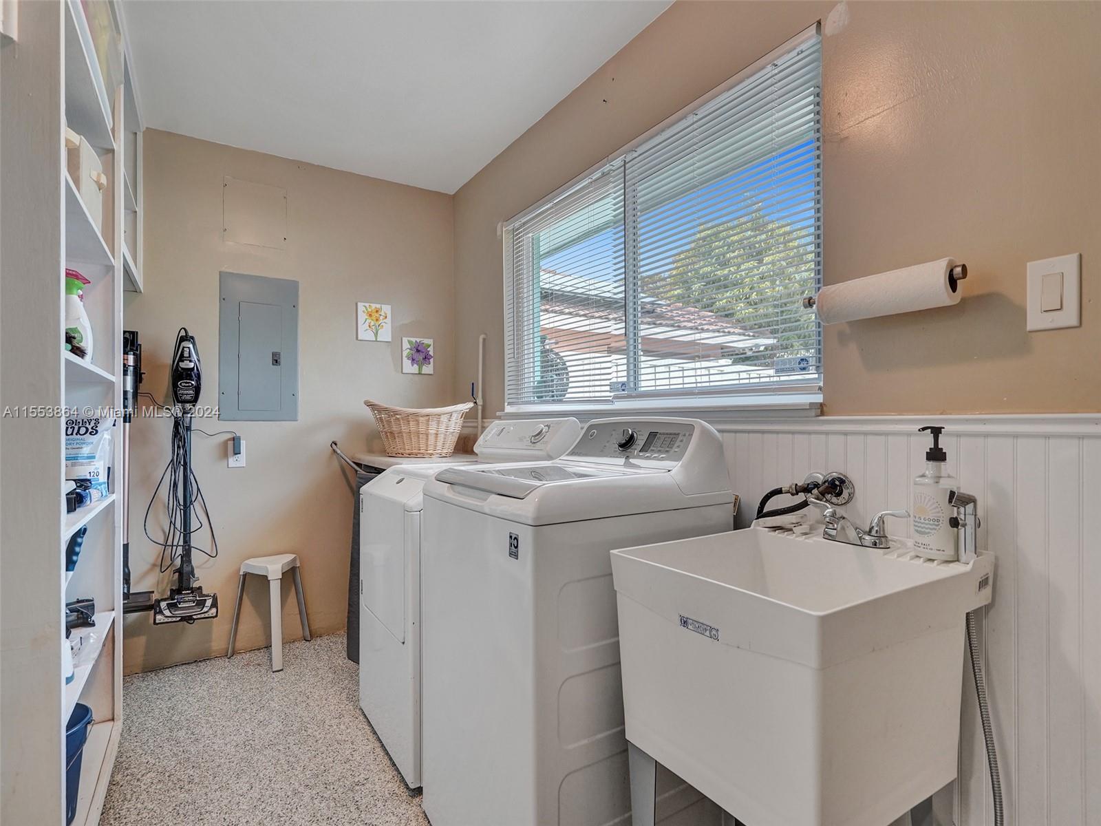 3445 Fillmore Street Hollywood, FL 33021 - Photo 48 of 76 a view of washer and dryer with bathroom in the background