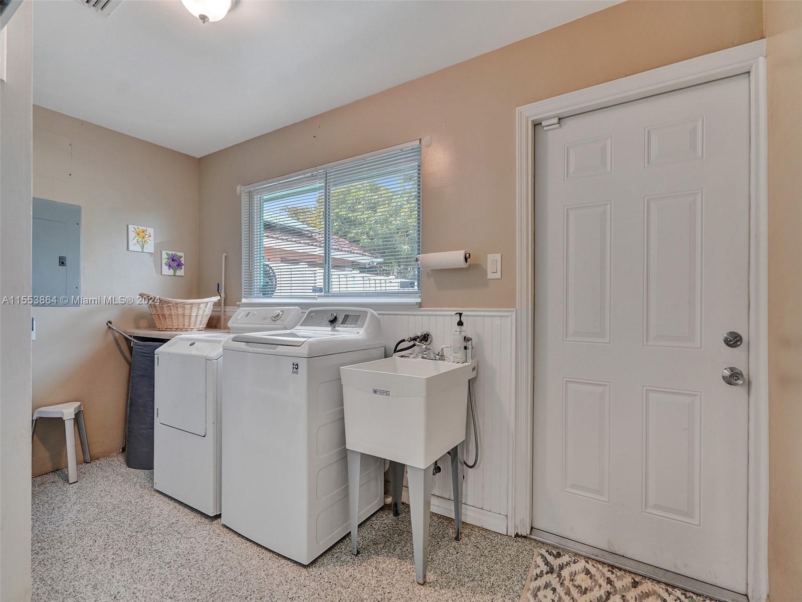 3445 Fillmore Street Hollywood, FL 33021 - Photo 49 of 76 a room with a sink cabinets and a window