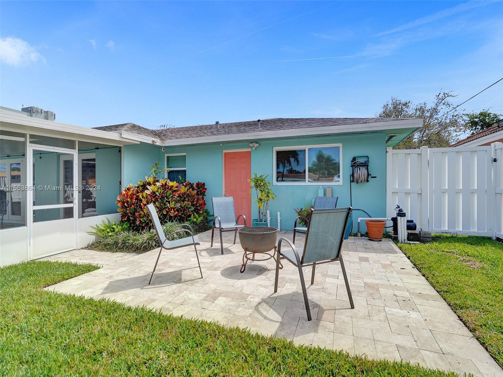 3445 Fillmore Street Hollywood, FL 33021 - Photo 57 of 76 a house view with a seating space and garden