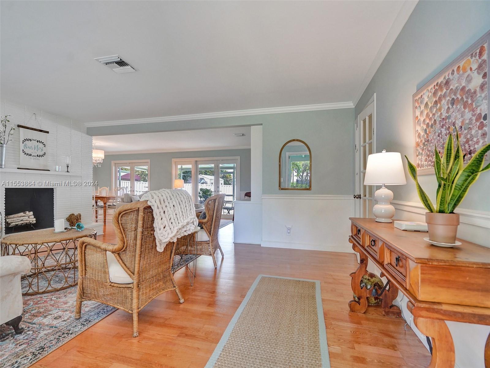 3445 Fillmore Street Hollywood, FL 33021 - Photo 6 of 76 a living room with furniture a table and a potted plant
