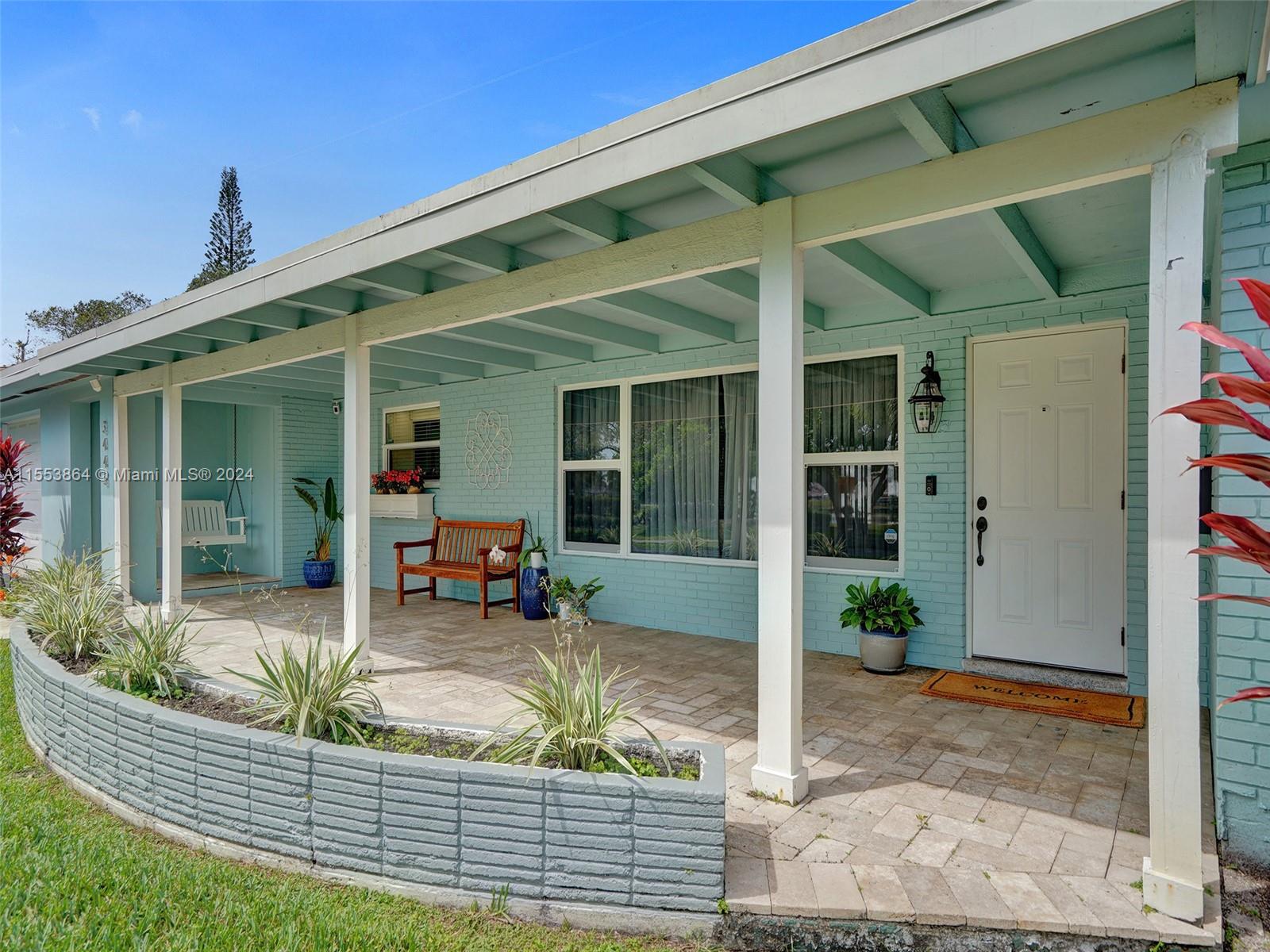 3445 Fillmore Street Hollywood, FL 33021 - Photo 63 of 76 a view of a house with porch and sitting area
