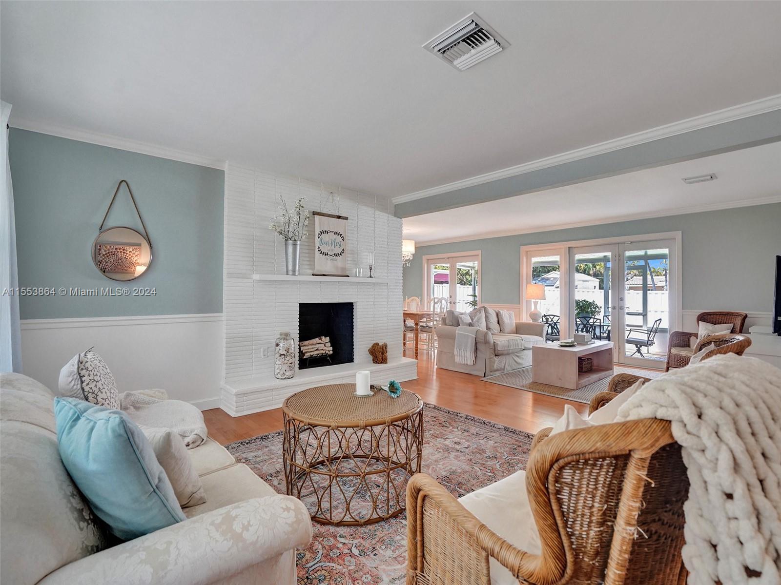3445 Fillmore Street Hollywood, FL 33021 - Photo 8 of 76 a living room with furniture couches and a fireplace