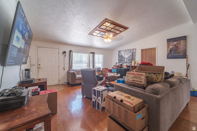 445 South Main Street Fayette, UT 84630 - Photo 29 of 45 Living area with wood finished floors and a textured ceiling