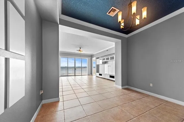 a kitchen with stainless steel appliances kitchen island granite countertop a stove a sink and a refrigerator