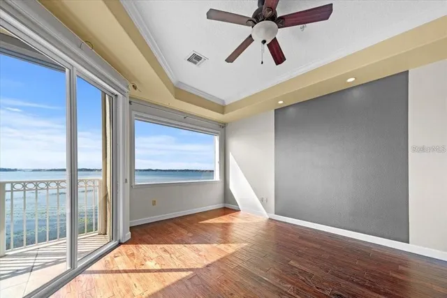 a view of kitchen with sink and refrigerator
