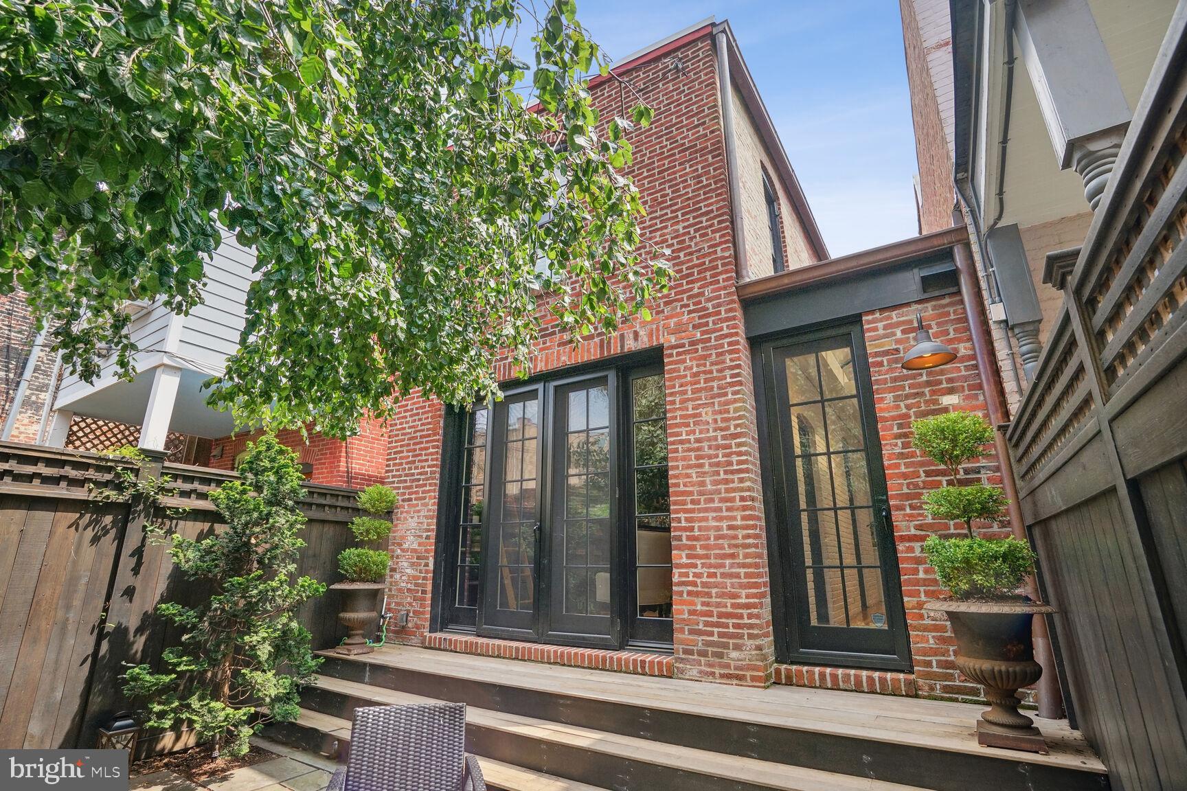 1102 East Capitol Street Northeast Washington, DC 20002 - Photo 8 of 28 Exterior Rear w/ access to Family Rm & Kitchen