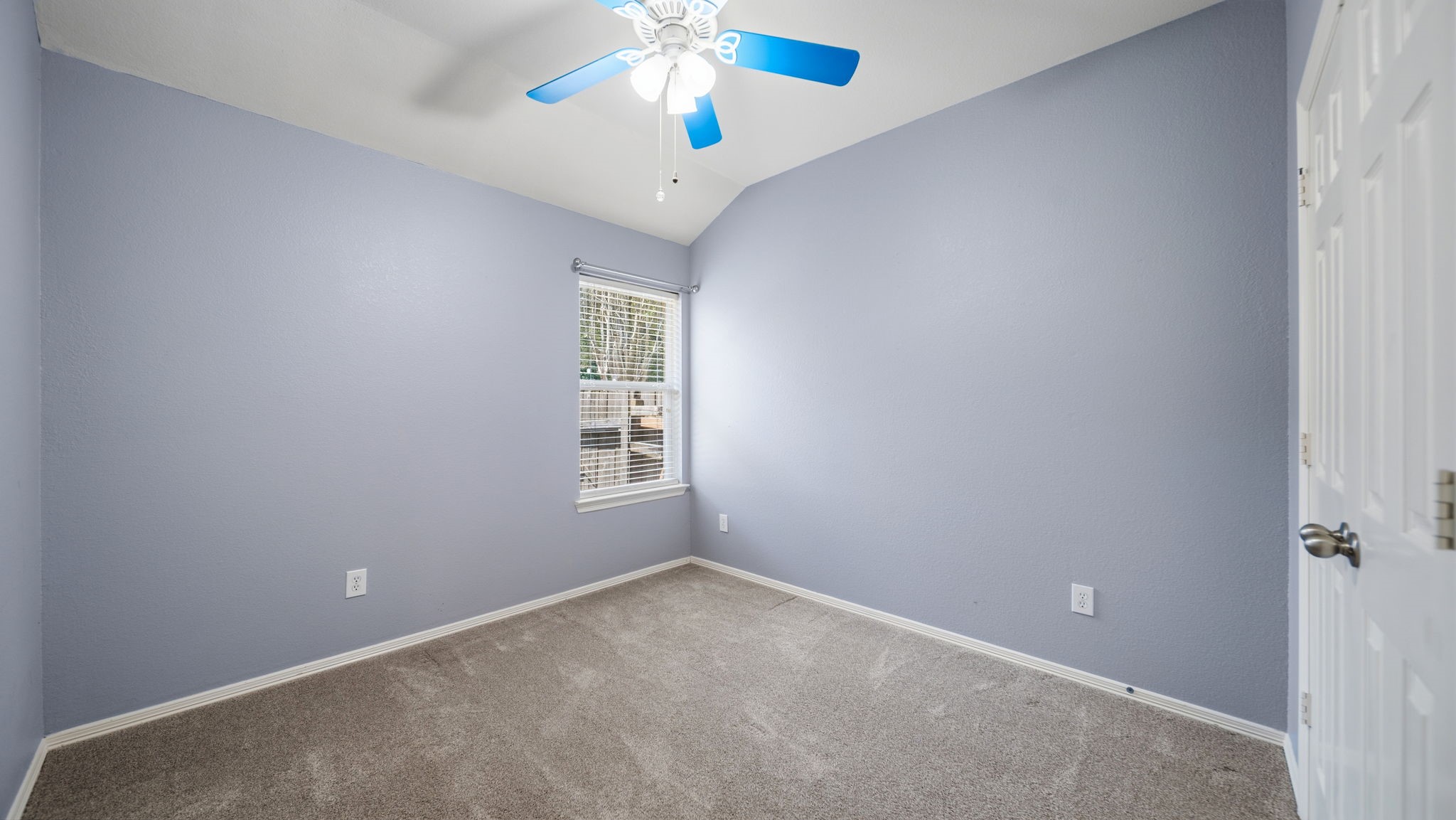 213 Mesa View Conroe, TX 77316 - Photo 14 of 19 an empty room with a window and a fan