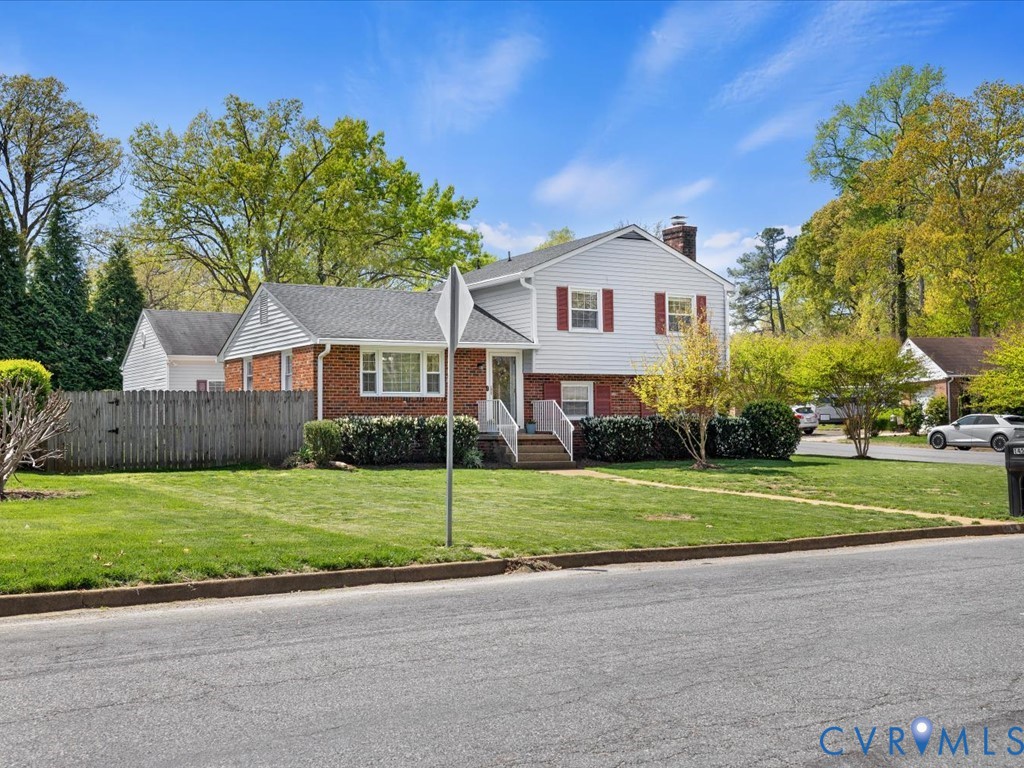 1455 Robindale Road Richmond, VA 23235 - Photo 27 of 29 a front view of a house with a yard and garage