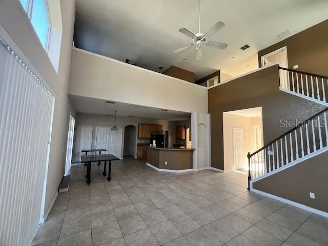 a view of livingroom with furniture and ceiling fan
