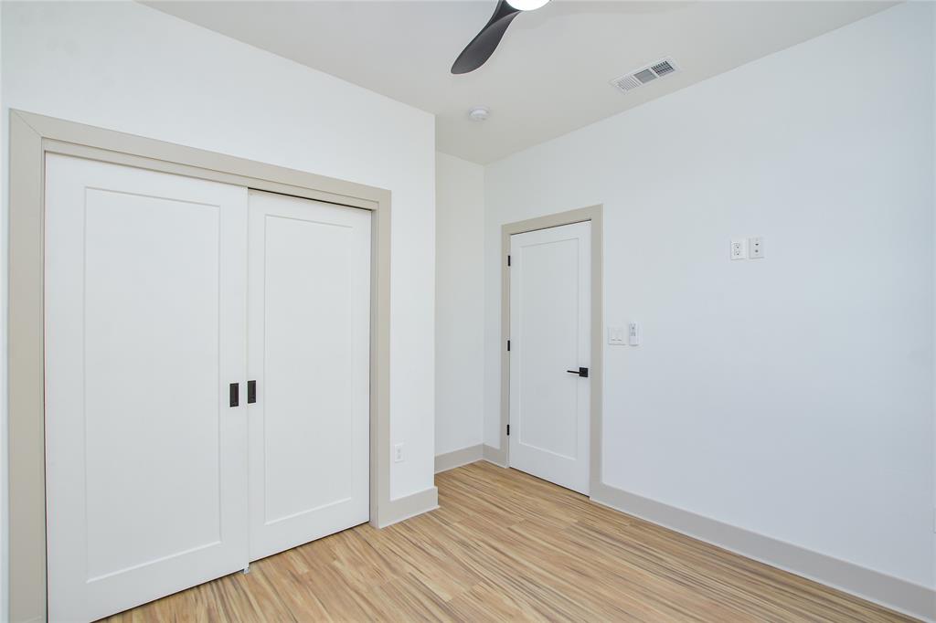 7103 Bennett Avenue, Unit 2 Austin, TX 78752 - Photo 11 of 19 a view of an empty room with wooden floor