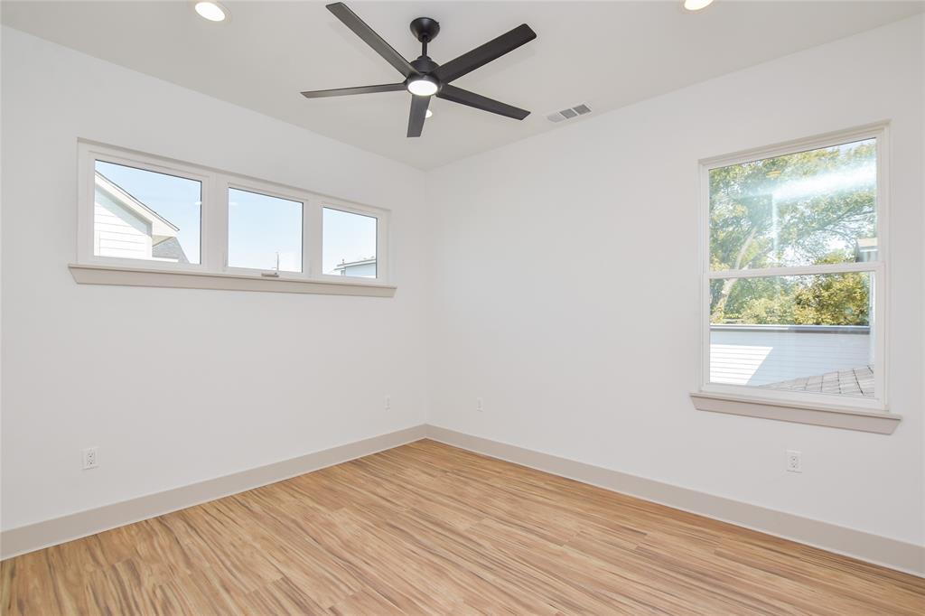 7103 Bennett Avenue, Unit 2 Austin, TX 78752 - Photo 15 of 19 a view of empty room with wooden floor and fan