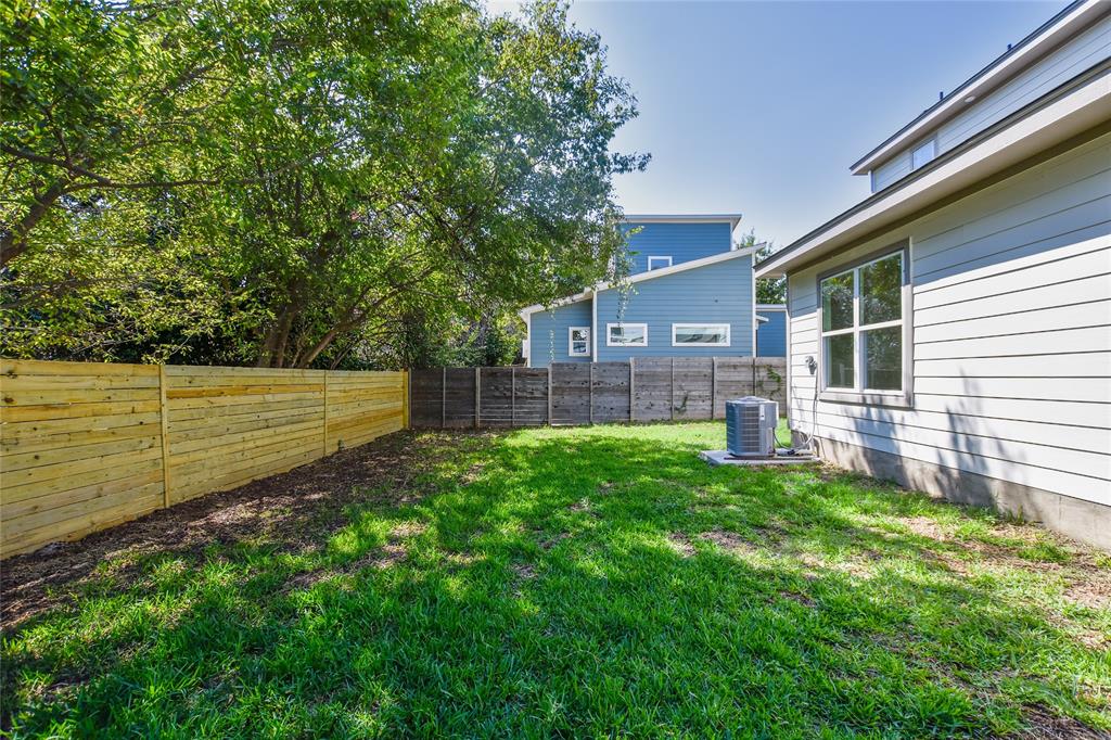 7103 Bennett Avenue, Unit 2 Austin, TX 78752 - Photo 18 of 19 a view of backyard with wooden fence