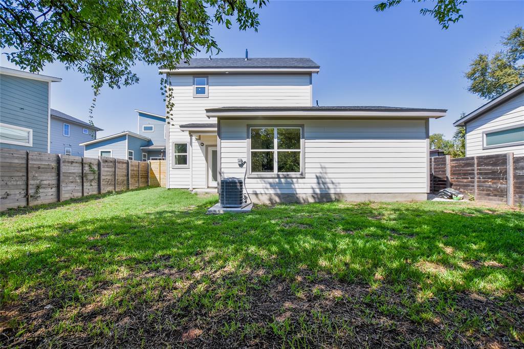 7103 Bennett Avenue, Unit 2 Austin, TX 78752 - Photo 3 of 19 a front view of a house with a garden