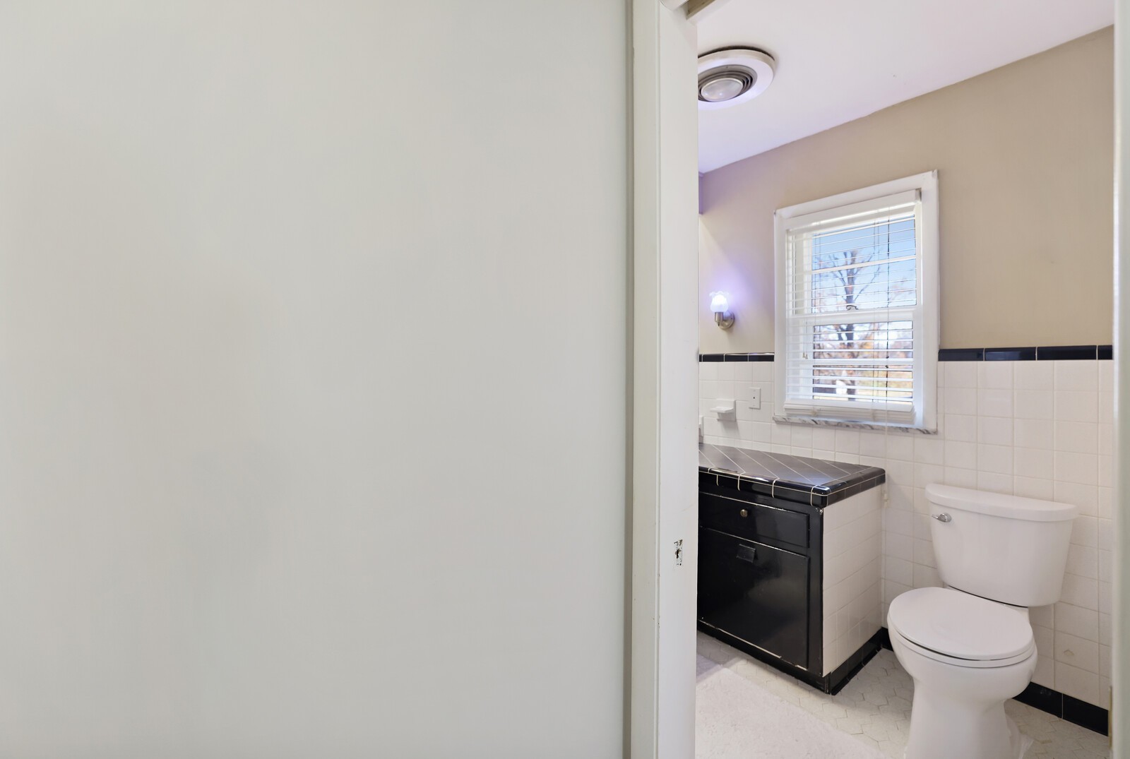 676 Ferguson Hill Road Lafayette, TN 37083 - Photo 44 of 89 a bathroom with a toilet a sink and mirror