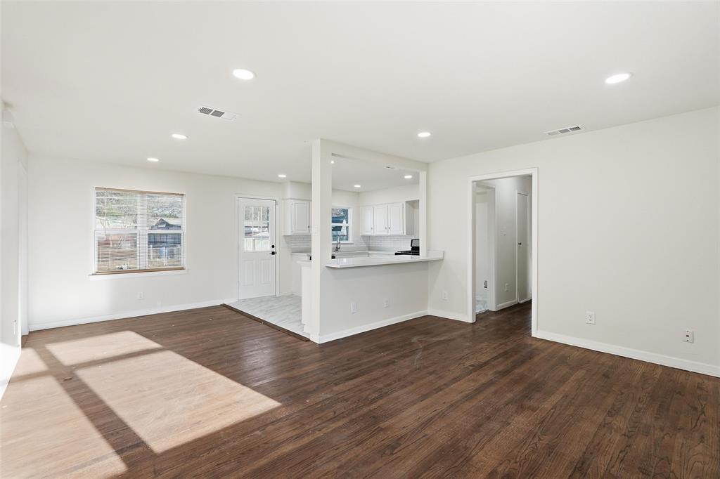 10833 Ruth Ann Drive Dallas, TX 75228 - Photo 2 of 17 a view of kitchen with wooden floor and window