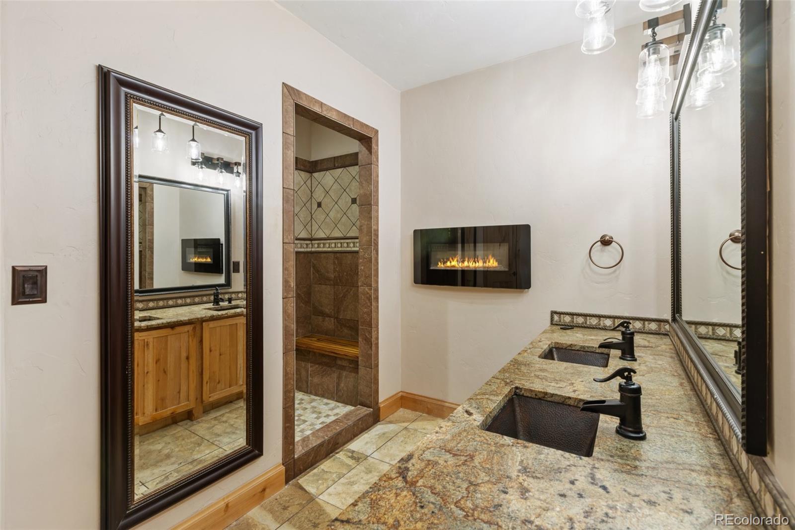 111 Blue Spruce Road Divide, CO 80814 - Photo 26 of 46 a bedroom with a bed and wooden floor