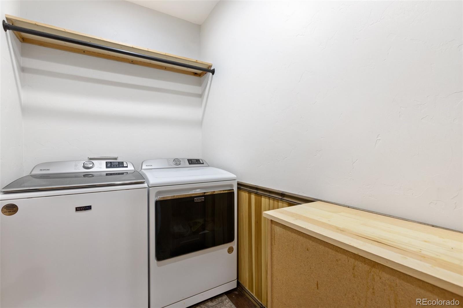 111 Blue Spruce Road Divide, CO 80814 - Photo 34 of 46 a utility room with dryer and washer