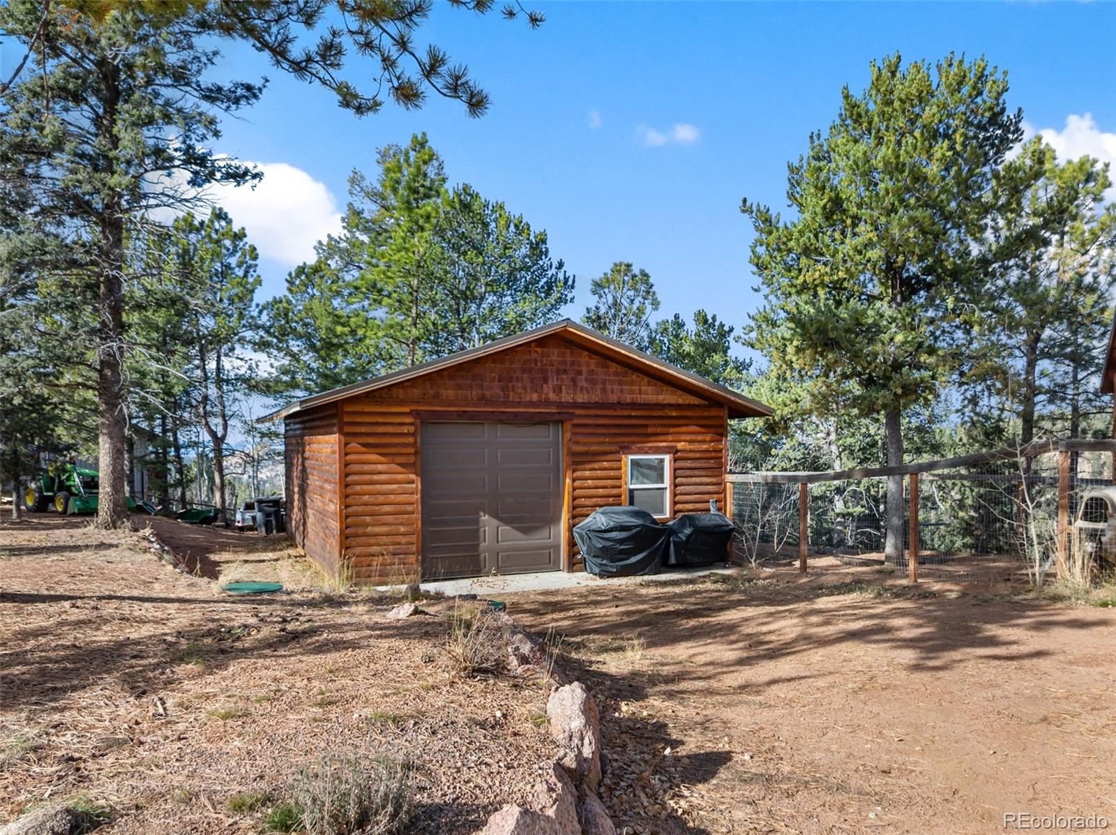 111 Blue Spruce Road Divide, CO 80814 - Photo 42 of 46 a view of a house with a yard