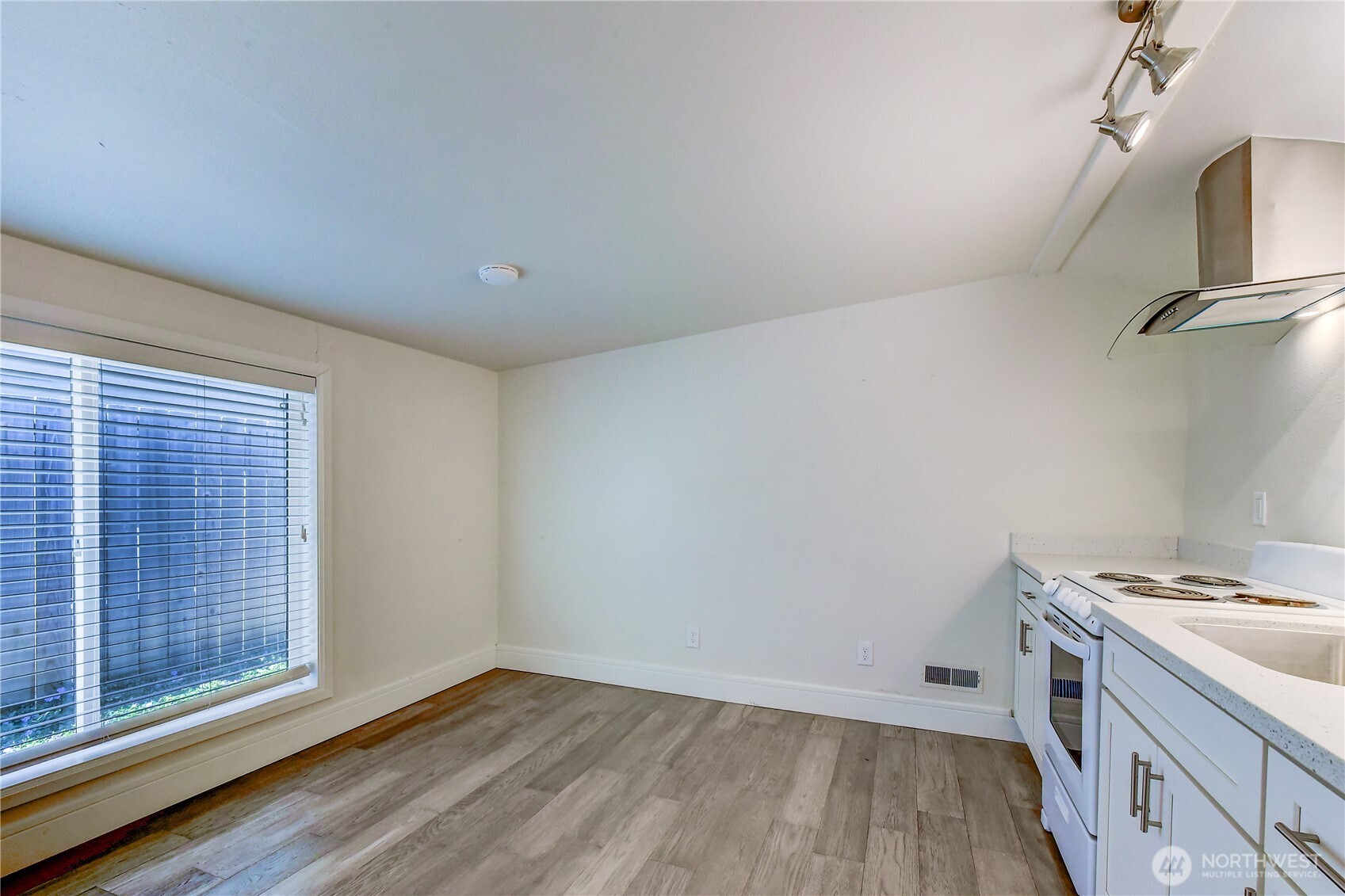 1048 South Director Street Seattle, WA 98108 - Photo 14 of 20 a view of storage and utility room with wooden floor