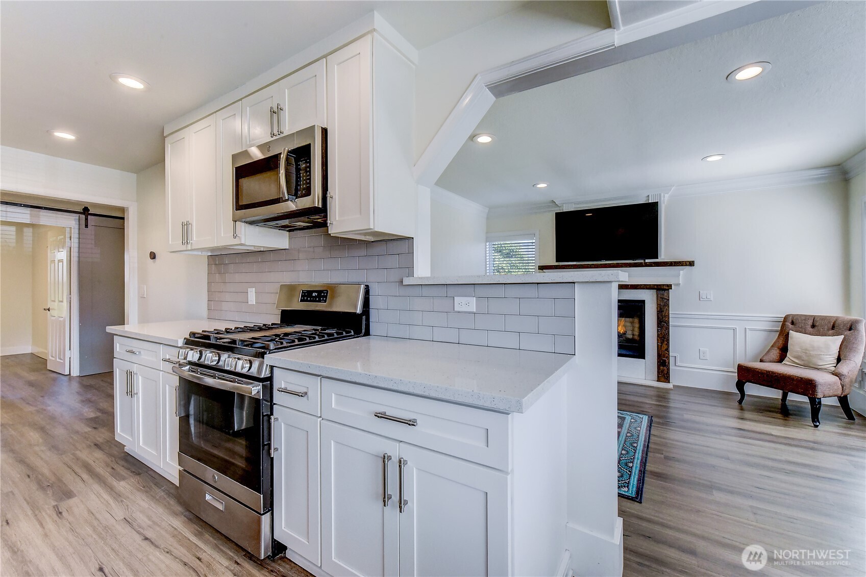 1048 South Director Street Seattle, WA 98108 - Photo 6 of 20 a kitchen with a stove and a microwave