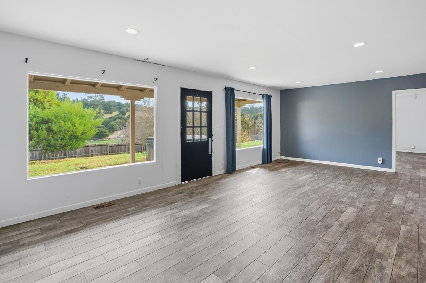 17918 Pesante Road Prunedale, CA 93907 - Photo 13 of 35 a view of an empty room with wooden floor and a window