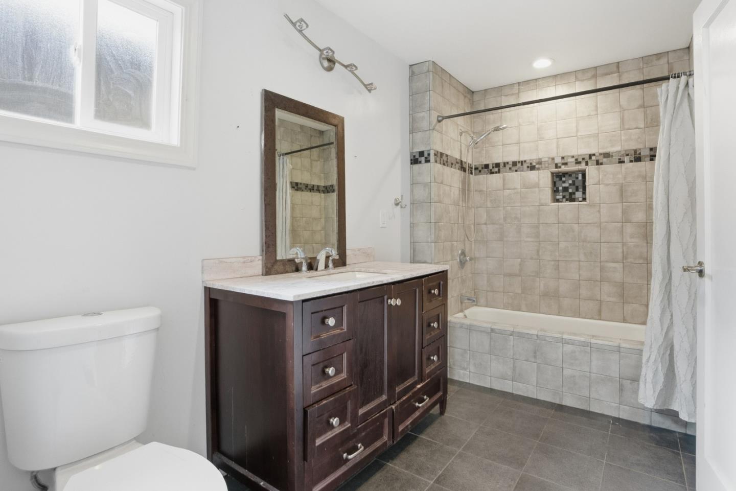 17918 Pesante Road Prunedale, CA 93907 - Photo 18 of 35 a bathroom with a shower sink vanity mirror and toilet