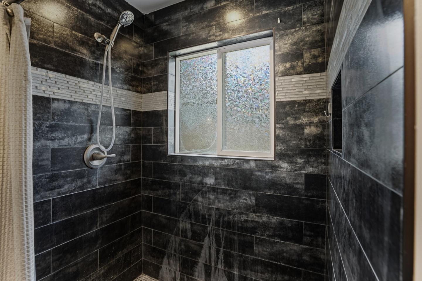 17918 Pesante Road Prunedale, CA 93907 - Photo 20 of 35 a bathroom with a glass door shower and toilet