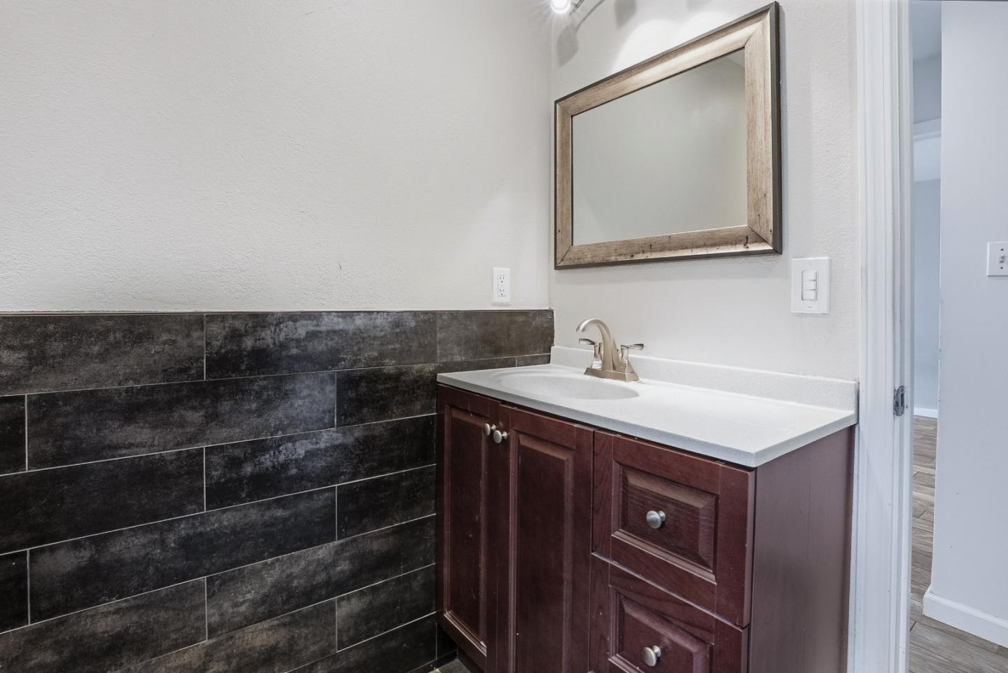 17918 Pesante Road Prunedale, CA 93907 - Photo 21 of 35 a bathroom with a sink a vanity and a mirror