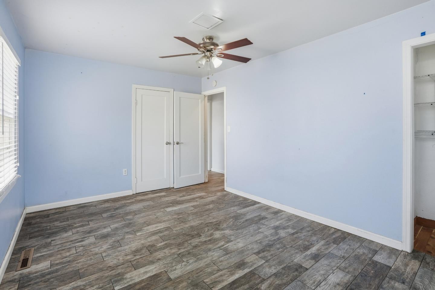 17918 Pesante Road Prunedale, CA 93907 - Photo 22 of 35 a view of a room with wooden floor and a ceiling fan