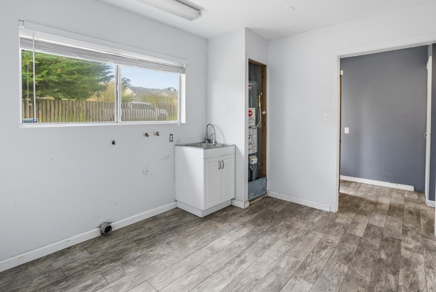 17918 Pesante Road Prunedale, CA 93907 - Photo 6 of 35 an empty room with wooden floor and windows