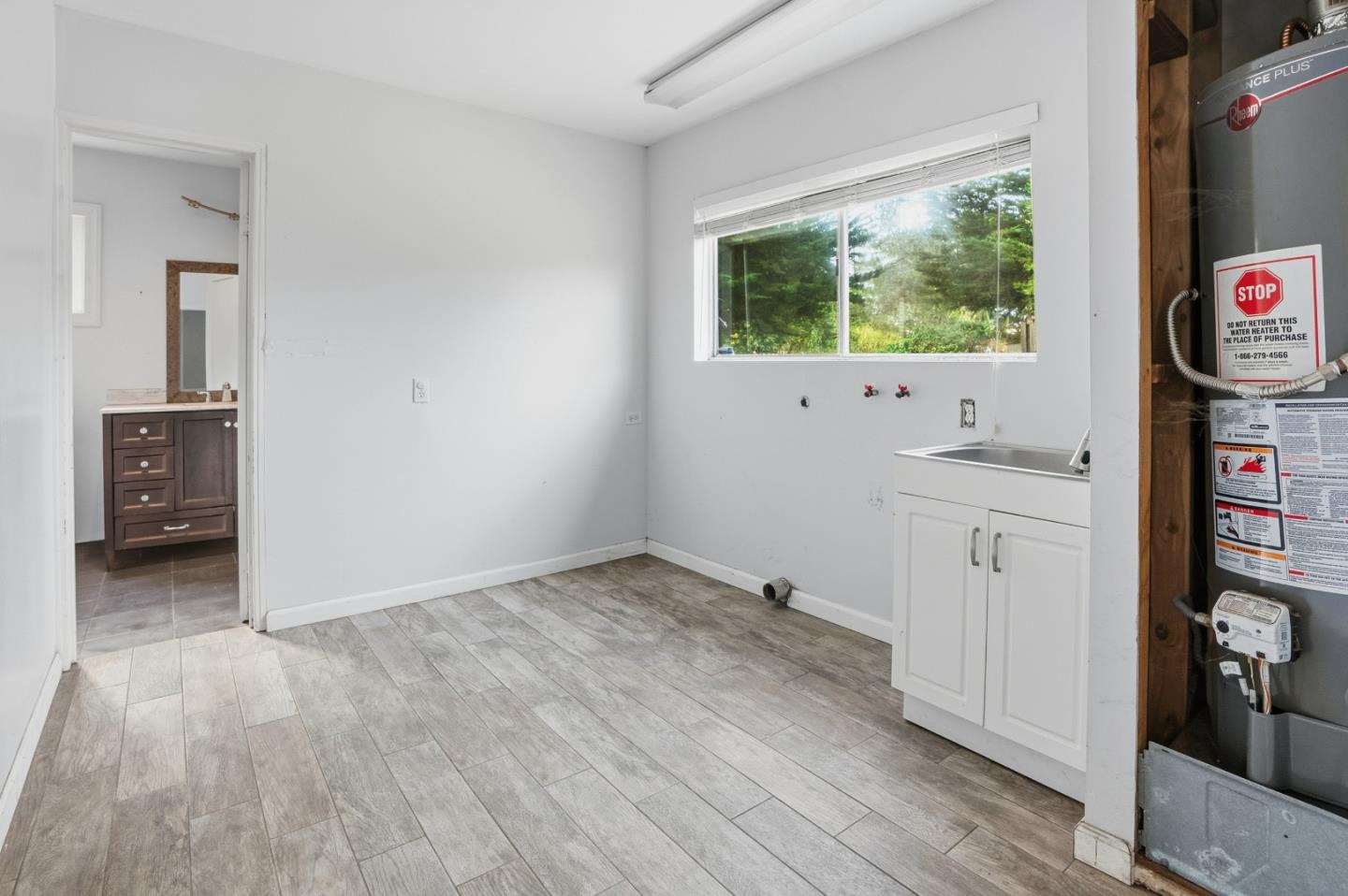 17918 Pesante Road Prunedale, CA 93907 - Photo 7 of 35 wooden floor in an empty room with a window