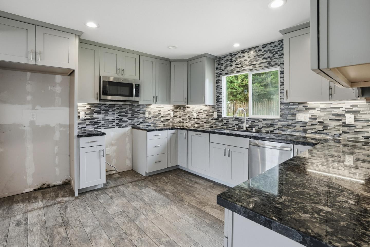 17918 Pesante Road Prunedale, CA 93907 - Photo 10 of 35 a kitchen with stainless steel appliances granite countertop a sink stove and refrigerator