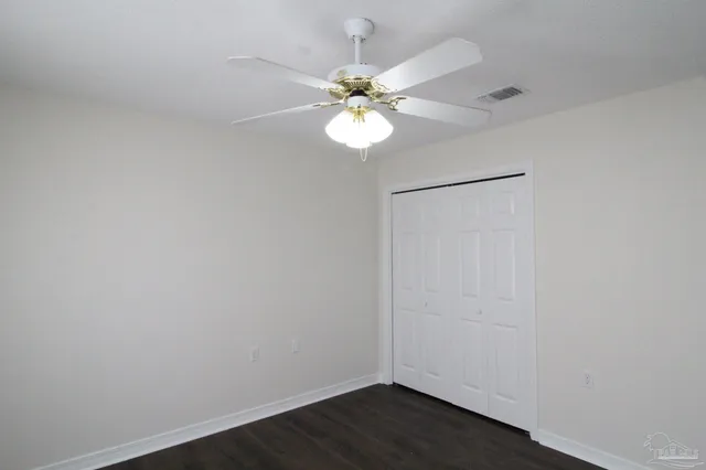 a view of a chandelier fan in a room