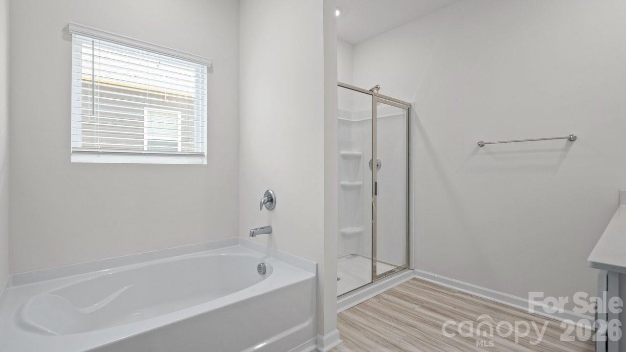 3688 Mercer Street Terrell, NC 28682 - Photo 33 of 34 a bathroom with a bathtub and a shower