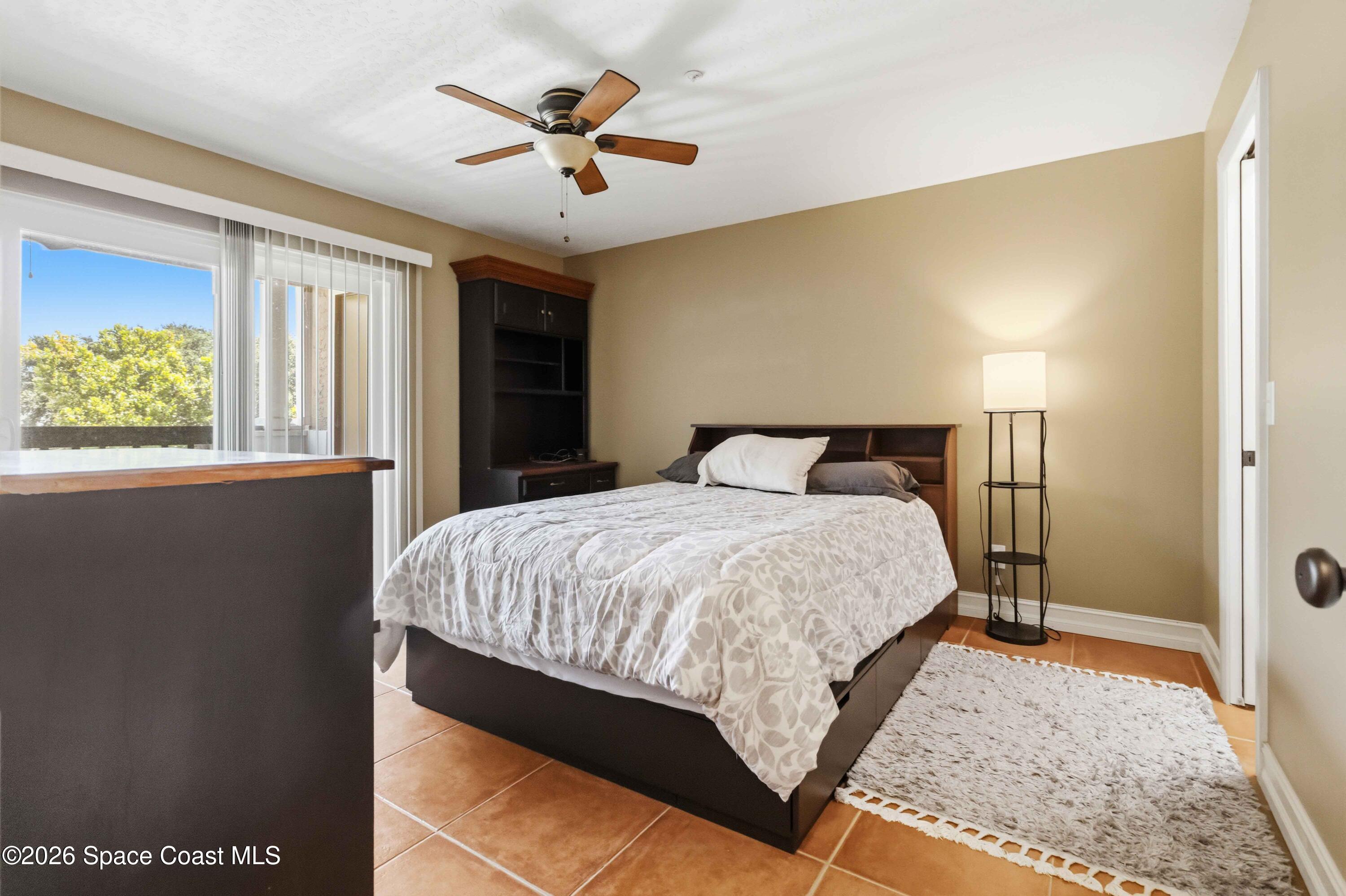 7667 North Wickham Road, Unit 519 Melbourne, FL 32940 - Photo 8 of 18 Spacious Bedroom overlooking the Balcony