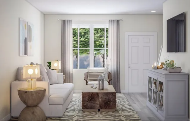 a living room with furniture and a table