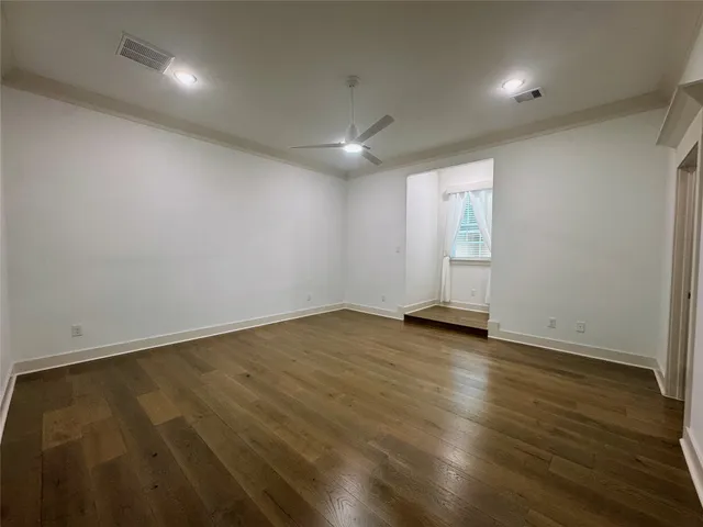 a view of walk in closet with empty racks