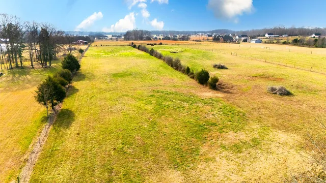 a view of a dining room with furniture and window