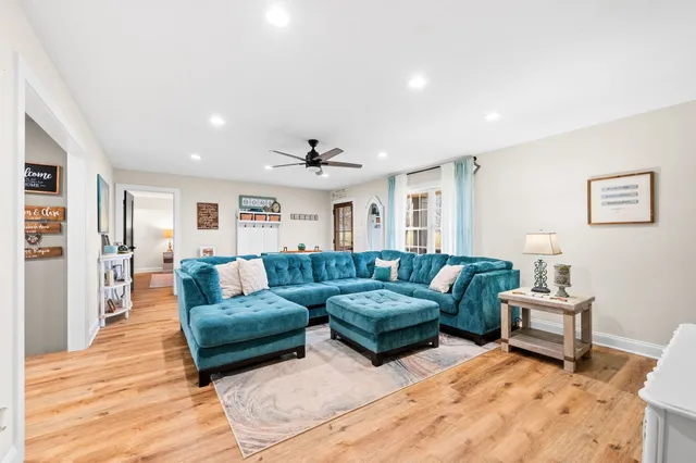 a bathroom with a sink a toilet and shower curtain
